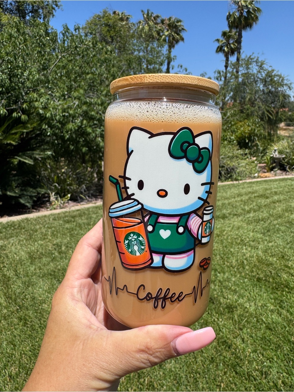 Hello kitty can glass tumbler with the look of coffee inside is 16oz
